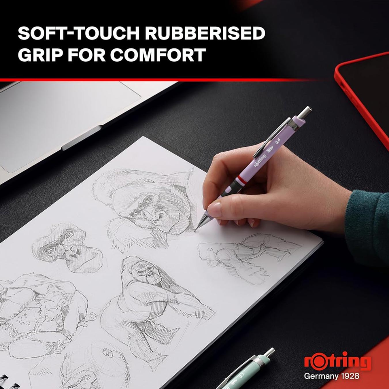 Person drawing sketches on a notebook with a Rotring Tikky 0.7mm Mechanical Pencil, emphasizing soft-touch rubberised grip for comfort.